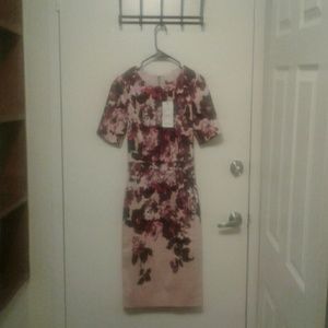 Light pink dress with plum colored flowers.
